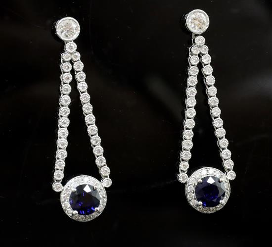 A pair of 18ct white gold, sapphire and diamond cluster drop earrings,